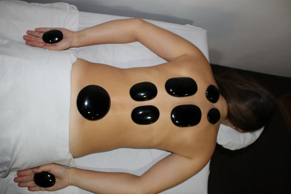 Masaje con Piedras Calientes en Línea